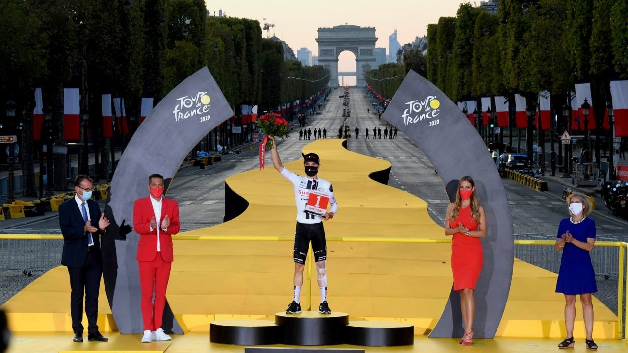 Marc Hirschi on the podium in the Avenue des Champs-Élysées