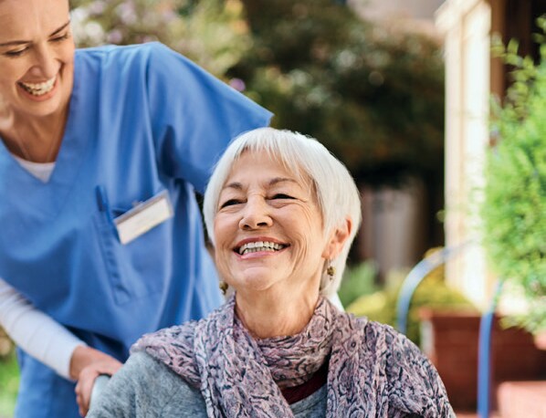 Shot of a senior woman and a nurse spending time together outside in a retirement home garden