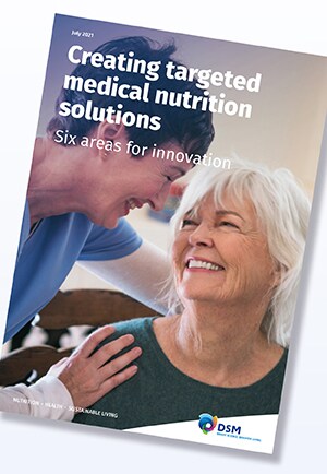 Front cover image of DSM’s medical nutrition guide showing smiling woman and nurse. 