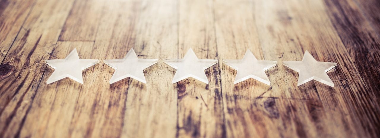five stars on a wooden desk