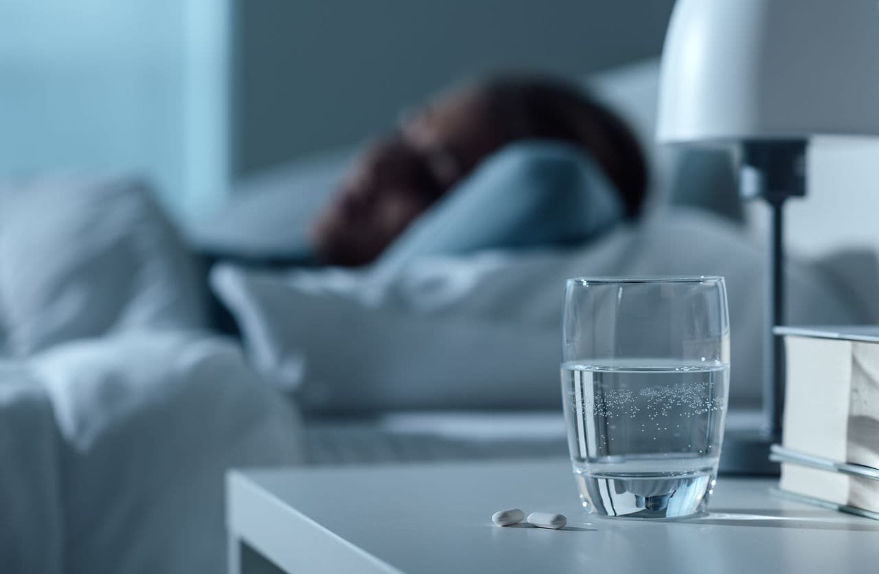 Glass of water and person sleeping 
