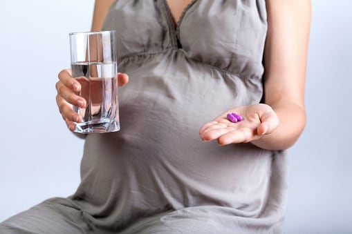Pregnant woman taking medicines